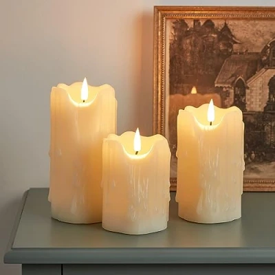 Image of Lights4fun Set of 3 TruGlow® Heavy Dripping Wax Battery LED Flameless Pillar Candles Real Ivory with Timer Indoor Use
