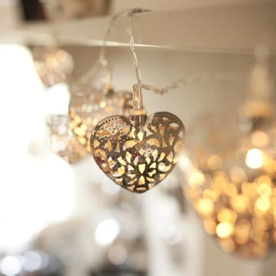 Image of Lights4fun 20 Warm White LED Silver Metal Filigree Heart Shaped String Fairy Lights Plug in Indoor Use 2.85m