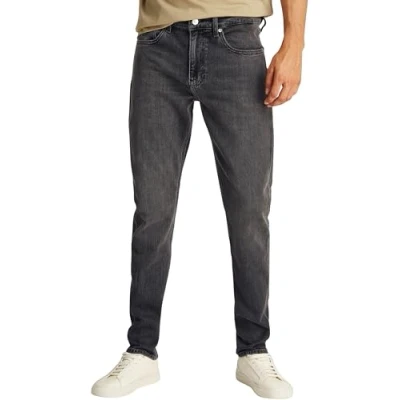Image of Calvin Klein Men’s Slim Taper Jeans with Stretch, Black (Denim Black), 32W/33L