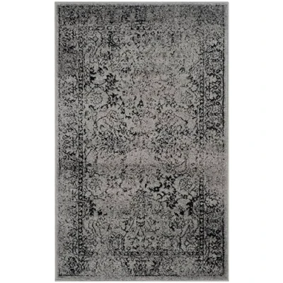 Image of SAFAVIEH Distressed Vintage Rug for Living Room, Dining Bedroom Adirondack Collection, Short Pile, in Grey and Black, 91 X 152 cm