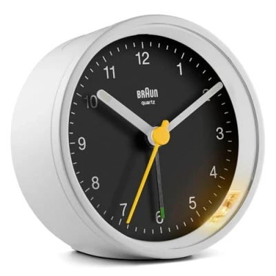 Image of Braun Classic Analogue Alarm Clock with Snooze and Light, Quiet Quartz Movement, Crescendo Beep in White Black, Model BC12WB.