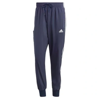 Image of adidas Men&#039;s AEROREADY Essentials Tapered Cuff Woven 3 Stripes Pants, Legend Ink/White, XL