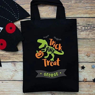 Image of Personalised dinosaur trick or treat bag (Black bag) Halloween bags options