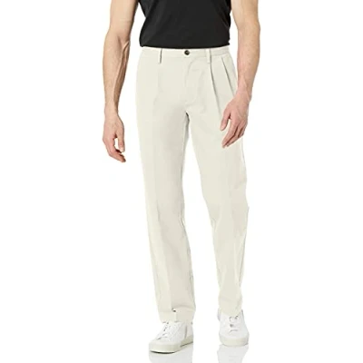 Image of Amazon Essentials Men&#039;s Classic Fit Wrinkle Resistant Pleated Chino Trouser (Available in Big &amp; Tall), Stone, 32W / 28L
