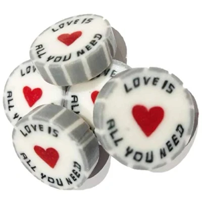 Image of 100 x Silver Wedding Favour Wrapped Rock Sweets with Love is All You Need. Pear Drop Flavour