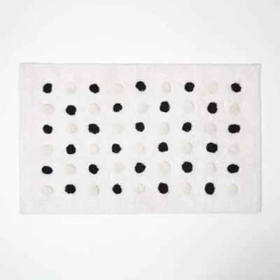 Image of HOMESCAPES Black and White Cotton Bath Mat with Polka Dot Design Super Absorbent Tufted Bathmat, 50 x 80 cm