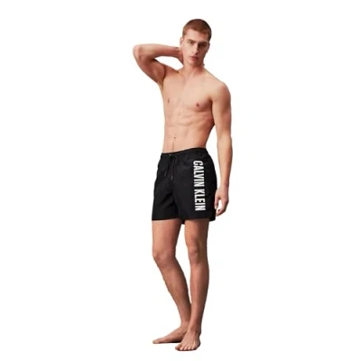 Image of Calvin Klein Men&#039;s Medium Drawstring Mid Length Swim Shorts, Black (Pvh Black), XL