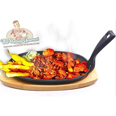 Image of Vintage Gourmet ® Premium Pre Seasoned Cast Iron Sizzler Serving Dish/Steak Platter with Wooden Stand, Black, 24 cm x 14 Create That authentic feel, serve your dishes sizzling at The table!