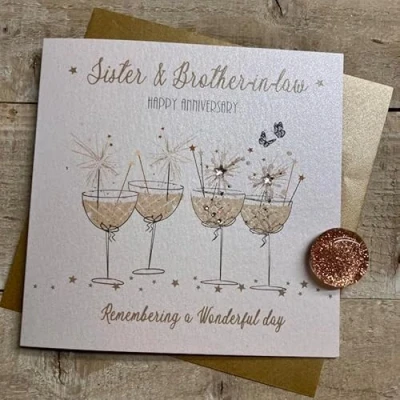 Image of WHITE COTTON CARDS SISTER &amp; BROTHER IN LAW COUPE GLASSES WITH SPARKLER ANNIVERSARY CARD, HAND FINISHED (D328)