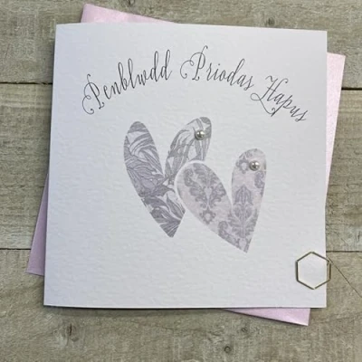 Image of WHITE COTTON CARDS PENBLWYDD PRIODAS HAPUS WELSH ANNIVERSARY CARD 2 HEARTS. HANDMADE (W SS37)
