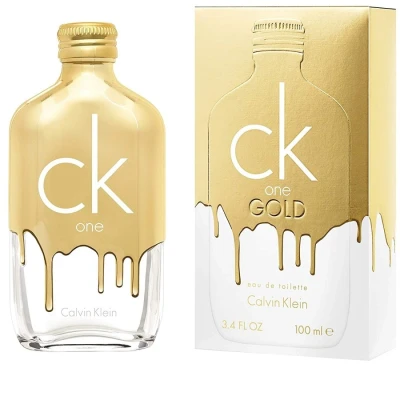 Image of CALVIN KLEIN CK One Gold Eau de Toilette for All Woody Fragrance Of Bergamot, Fig, Sage, Neroli, Violet, Jasmine, Guaiac, Patchouli, Vetiver Medium Longevity 3.4oz