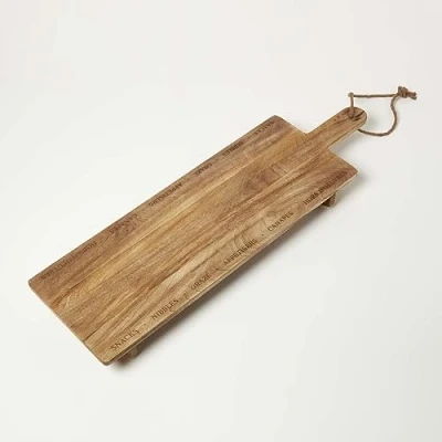 Image of HOMESCAPES Mango Wood Charcuterie Board with Etched Decorative Words and Slogans for Serving, 100 cm
