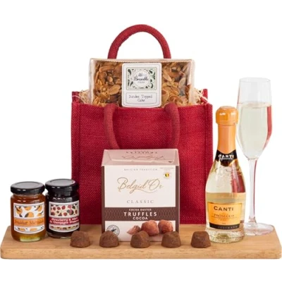 Image of InterHamper Prosecco and Cake Goody Bag Hamper Gift with Prosecco, Cake, Chocolates more all presented in a Red Jute