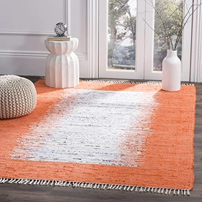 Image of SAFAVIEH Modern Rug for Living Room, Dining Bedroom Montauk Collection, Short Pile, in Ivory and Orange, 122 X 183 cm