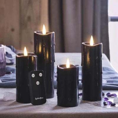 Image of Lights4fun Set of 4 Slim TruGlow® Battery Operated LED Flameless Pillar Candles Black Dripping Effect Real Wax with Timer and Remote Control Indoor Use