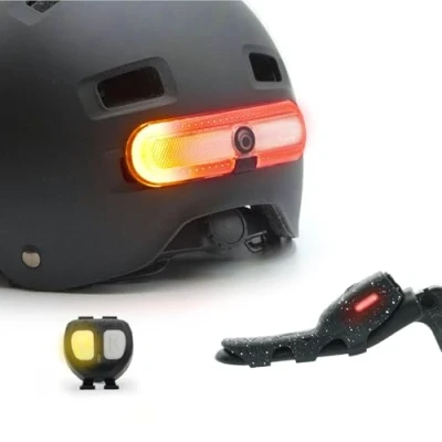 Image of OxiTurn deluxe pack including an light for bikes, scooters or helmets, with 5 red modes and right/left turn signals, OxiMote remote OxiBrake device to activate brake function