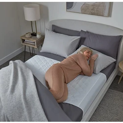 Image of Waterproof bed pad with wings by GuardedSleep Premium quality washable wetting sheet for adults or children incontinence Suitable double and king size beds Discreet White