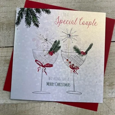 Image of WHITE COTTON CARDS SPECIAL COUPLE COUPE GLASSES WITH SPARKLERS CHRISTMAS CARD, HAND FINISHED (C23 38)
