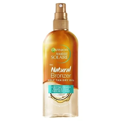 Image of Garnier Ambre Solaire Natural Bronzer Self Tan Dry Oil 150ml,2 in 1 Enriched With Coconut Oil,Nourishes Skin &amp; Leaves A Luminous Fake Tan,Natural Streak Free Result,Lasts Upto week,Vegan Formula