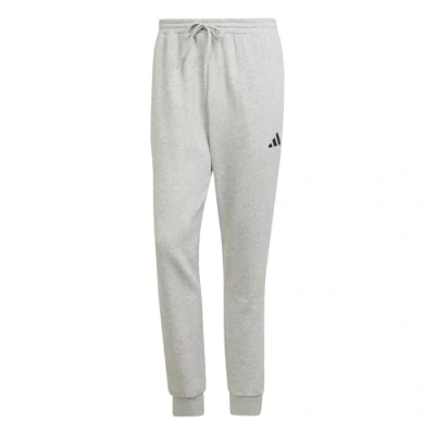 Image of adidas Sportswear Essentials FEEL COZY Tracksuit bottoms, Men&#039;s, Size: Medium, Medium grey heather/black