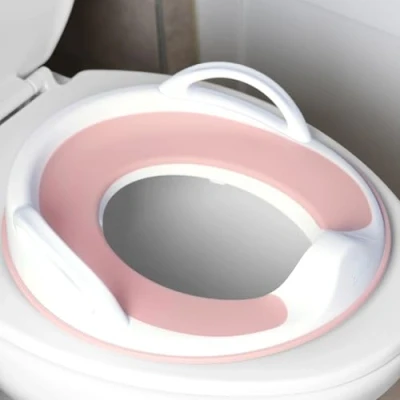 Image of Jool Baby Potty Training Seat for Boys and Girls with Handles, Fits Round &amp; Oval Toilets, Non Slip Splash Guard, Includes Free Storage Hook (Pink)