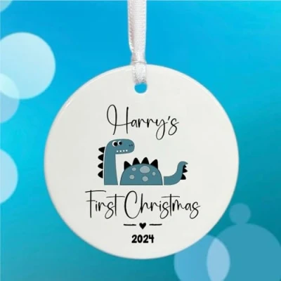 Image of Luck and Personalised Baby&#039;s First Christmas Dinosaur Bauble, Porcelain Hanging Tree Decoration, New Baby Keepsake Gift, Bauble with Name