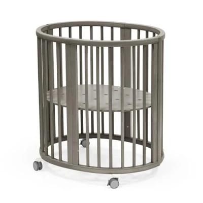 Image of Stokke Sleepi Mini, Hazy Grey Oval Crib Suitable for 0 6 Months Height Adjustable Base, Lockable Swivel Wheels, Perforated Mattress Base Air Circulation