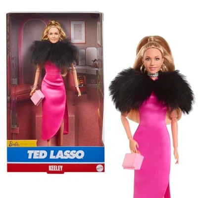 Image of Barbie Signature Doll, Keeley Jones from Ted Lasso Wearing Pink Dress with Faux Fur Cape, Collectible Displayable Packaging, HJW92