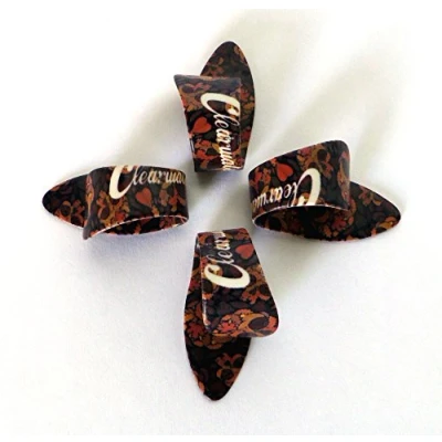 Image of THUMB PICKS SET OF 4 FLORAL SKULLS PLECS PLECTRUMS SIZE MEDIUM/LARGE BY CLEARWATER