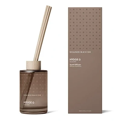 Image of Skandinavisk HYGGE Reed Diffuser with 8 Reeds. Lasts +3 Months. Fragrance Notes: Black Tea and Mint Leaves, Dried Apples Baked Cinnamon. 200 ml