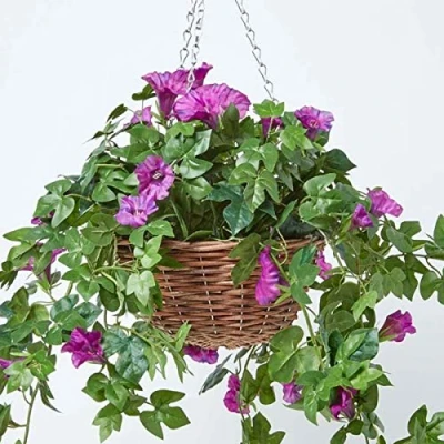 Image of HOMESCAPES Purple Petunia Artificial Hanging Basket Large Lifelike Plant For Indoor and Outdoor Decoration Trailing Flowers In Brown Wicker Pot with Silver Metal Chain Hook 80 cm Long