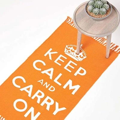 Image of HOMESCAPES Rugs For Bedroom, Handwoven &#039;Keep Calm and Carry On&#039; Nostalgic Orange &amp; White Living Room Area Rug, Ultra Soft 100% Cotton Carpet, Hand Block Printed 60 x 100 cm