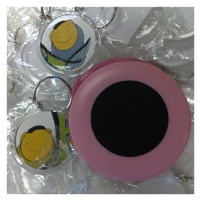Image of 10 Round Keyrings 34 mm Diameter Insert 09010 and a Matching Photo Punch 9010PP