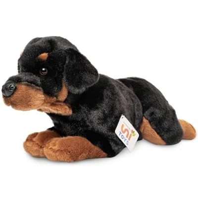 Image of Uni Toys Rottweiler lying down 39 cm (length) plush dog, pet toy, cuddly black brown