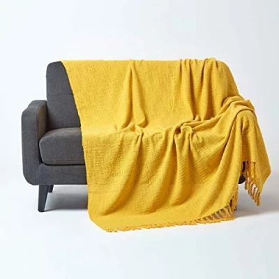 Image of HOMESCAPES Nirvana Ochre Yellow Handwoven 100% Pure Cotton Throw 100 x 140 Inches, Bedspread Blanket with Handknotted Tassels in Very Durable and Heavy Quality, Easy Care Washable at Home