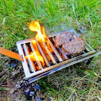 Image of Volcann Portable Stainless Steel Mini Fire Pit BBQ with Spike Grill Holder Bottle Opener Flatpack Barbecue Smoker Stove Cook for Travel, Camping, Hiking, Fishing (220x110 mm)