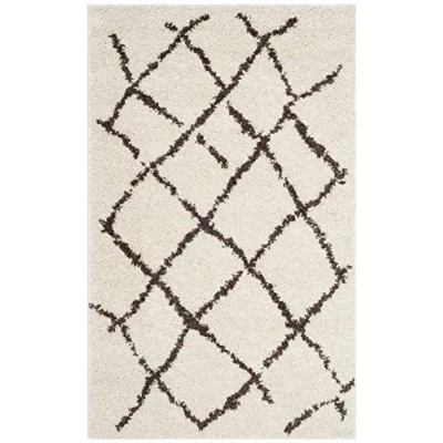 Image of SAFAVIEH Moroccan Shaggy Rug for Living Room, Dining Bedroom Berber Shag Collection, Short Pile, in Creme and Brown, 91 X 152 cm