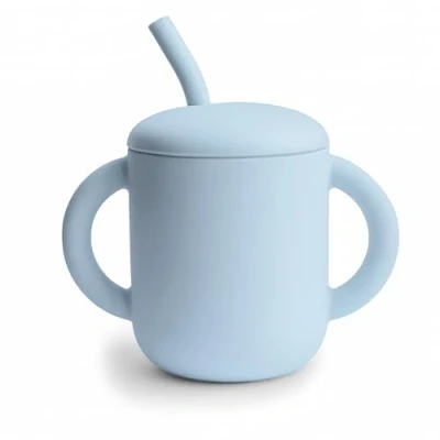 Image of Mushie Silicone Training Cup + Straw Baby Sippy with 6+ Months First Capacity: 175 mL Removable Lid Material: Food Grade Dishwasher &amp; Microwave Safe (Powder Blue)
