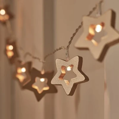 Image of Lights4fun 20 Dimmable Warm White LED Night Light Wooden Star String Fairy Lights Battery Operated with Timer and Remote Control Indoor Use
