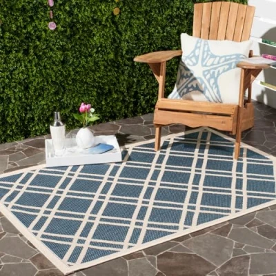 Image of SAFAVIEH Trellis Rug for Indoor &amp; Outdoor Courtyard Collection, Short Pile, in Navy and Beige color, 122 X 170 cm