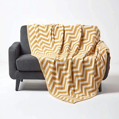 Image of HOMESCAPES Mustard Knitted Throw Soft Cotton Geometric Blanket Handwoven Warm and Cosy Dark Yellow Off White 100% Chevron Herringbone Sofa Bed Throw, 130 x 170 cm