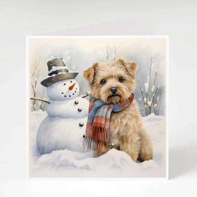 Image of Norfolk Terrier Christmas Cards Pack of 5 next to a tree. Printed on 300gsm card