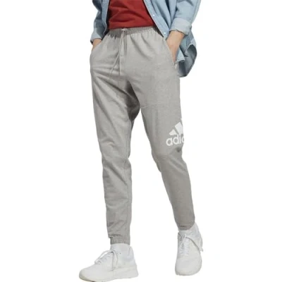 Image of adidas Men&#039;s Essentials Single Jersey Tapered Badge of Sport Pants, Medium Grey Heather, M