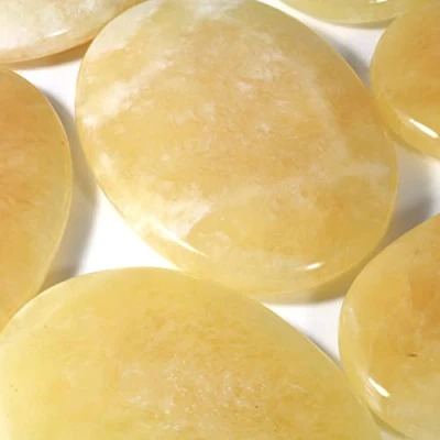 Image of CrystalAge Orange Calcite Palm Stone 70x50mm