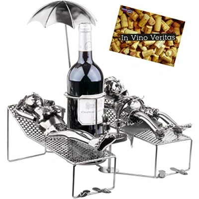 Image of BRUBAKER Wine Bottle Holder Lovers on Holiday Metal Sculpture Stand Lying Couple under Palm Tree Silver Figurine Gift for Vacationers with Greeting Card
