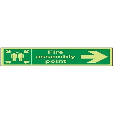 Image of VSafety 17022BJ G &quot;Fire Assembly Point Arrow Right&quot; Sign, Glow In Dark, 1 mm Plastic, Landscape, 450 x 150 mm, Green