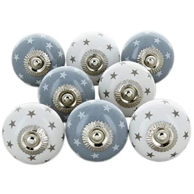 Image of Set of 8 ceramic knobs with white and blue stars, hand painted different designs. Handcrafted handles for cabinets, drawers, dressers hangers. Classic 40mm diameter.