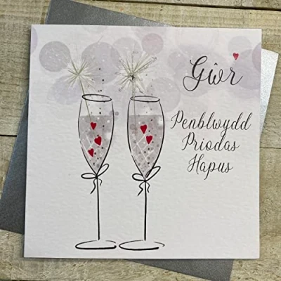 Image of White Cotton Cards GWR PENBLWYDD PRIODAS HAPUS (HUSBAND, HAPPY ANNIVERSARY) FLUTES WITH SPARKLER WELSH ANNIVERSARY CARD, HANDFINISHED (W D38)