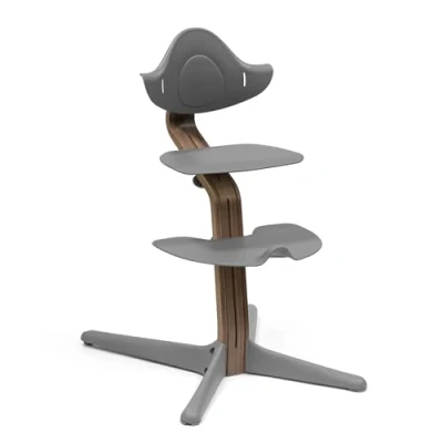 Image of Stokke Nomi Chair, Walnut/Grey Inspires Active Sitting Tool Free, Seamless Adjustability Includes Stable Footrest &amp; Anti Tilt Wheels Holds Up to 150 kg
