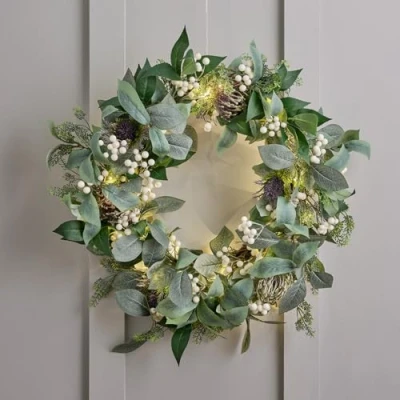 Image of Lights4fun 60cm Pre Lit Christmas Wreath White Berries Eucalyptus Mixed Foliage Indoor Decoration 50 Warm LEDs Battery Operated with Timer